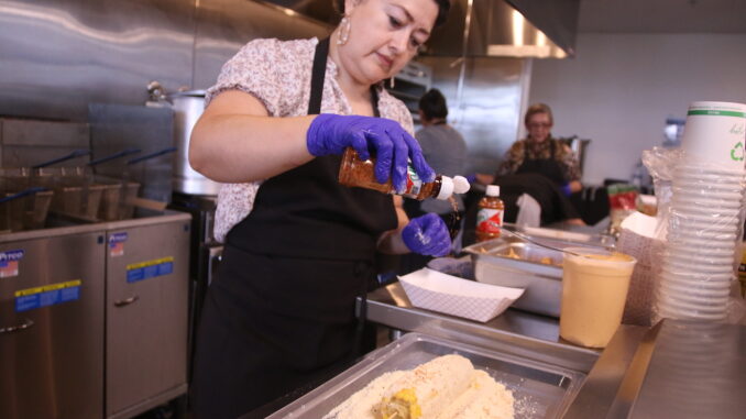 Image of Comal participant preparing food